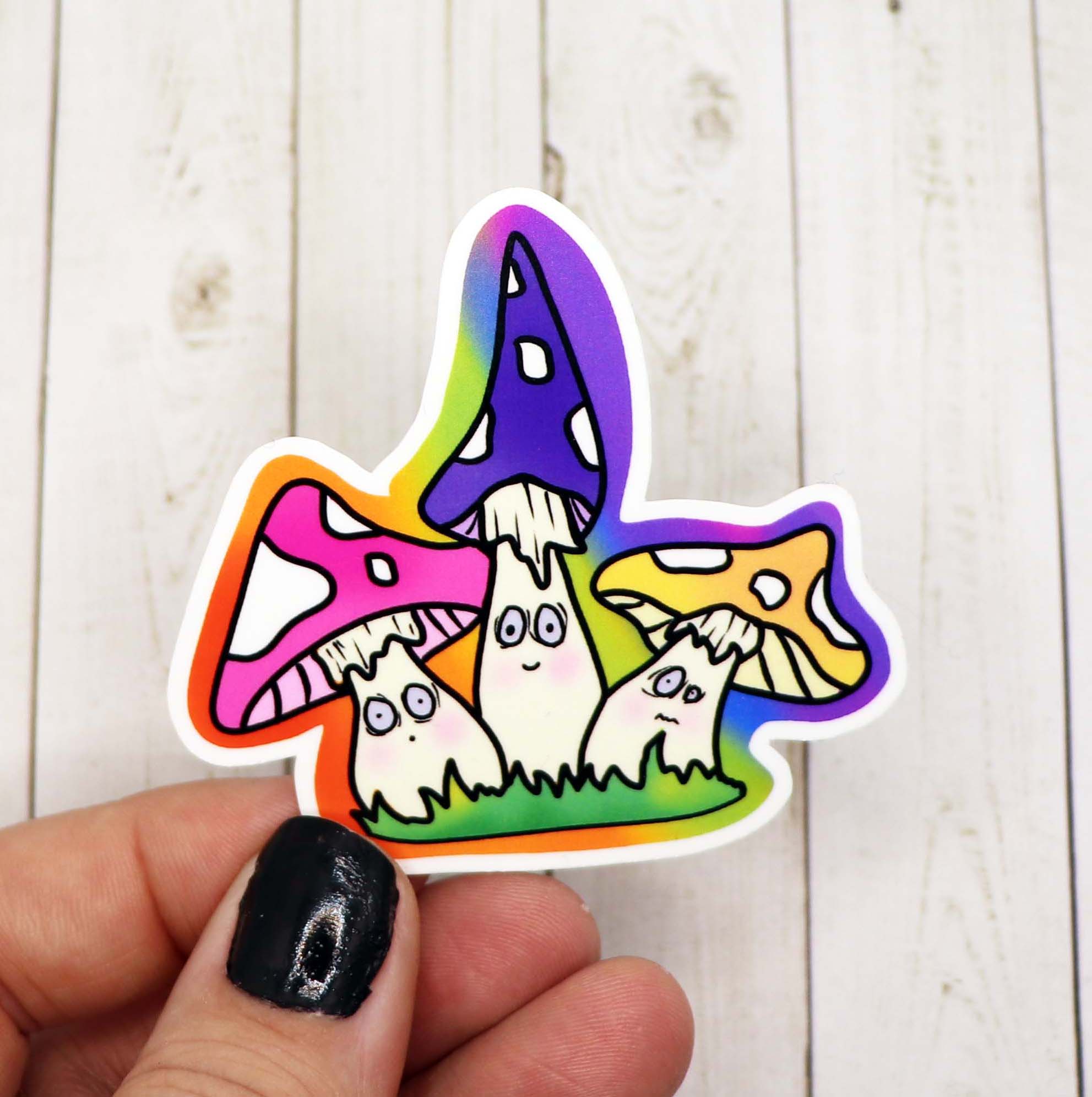 A colorful Mushroom Friends Sticker featuring whimsical mushroom designs on a matte vinyl background.