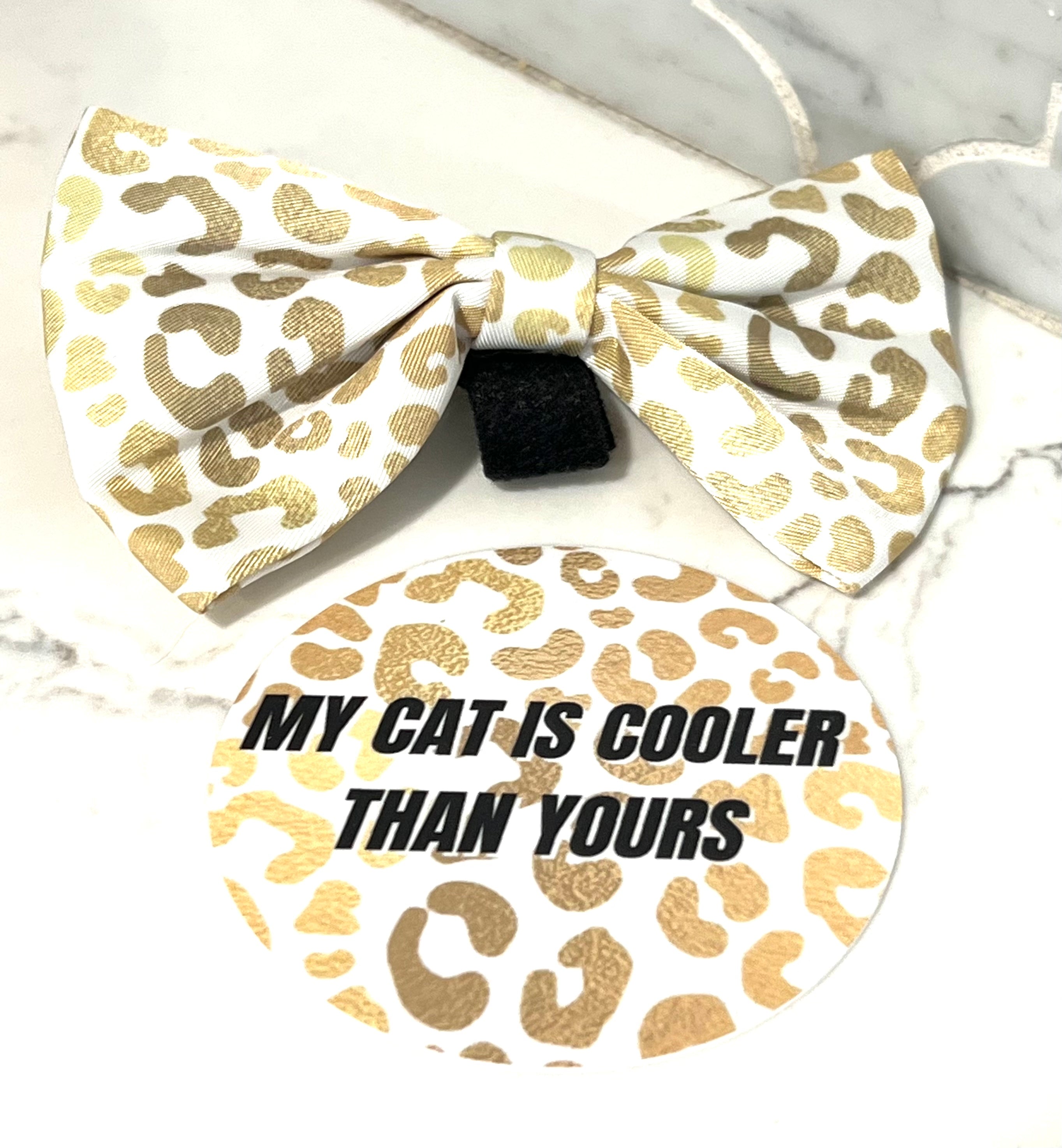 A 3-inch vinyl circle sticker featuring the phrase 'MY CAT IS COOLER THAN YOURS' with a playful design, perfect for cat lovers.