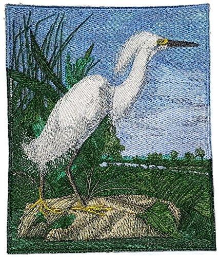 Snowy Heron embroidered patch showcasing intricate details and vibrant colors on a cotton base, perfect for garments.