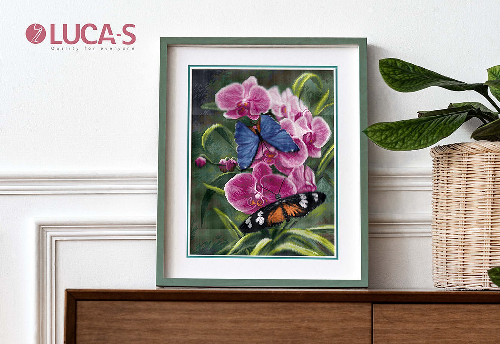 Nature's Poetry B7010L Counted Cross-Stitch Kit with Aida canvas, needle, and colorful threads displayed on a table.