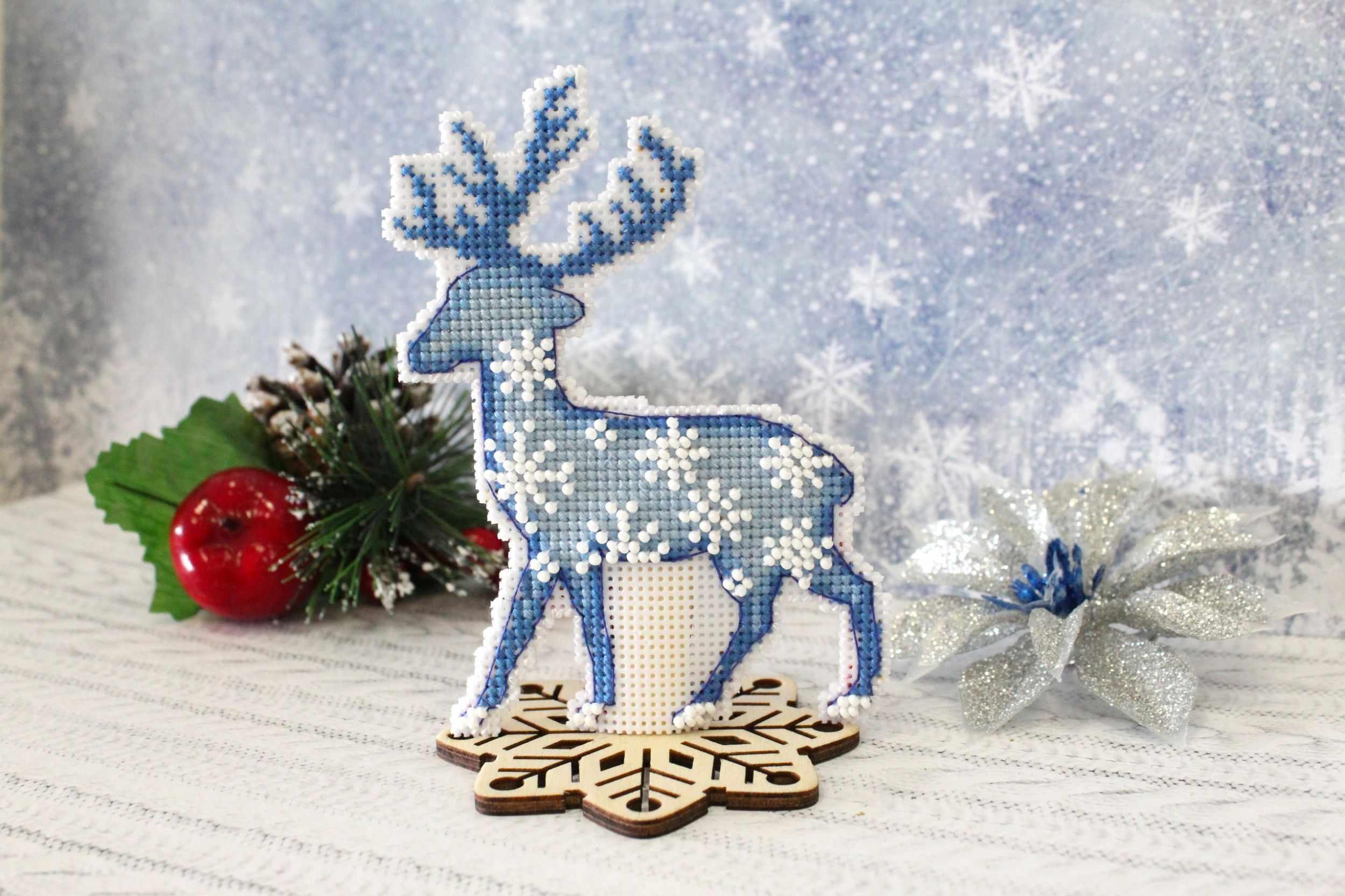 Northern Deer P-455 / SR-455 Plastic Canvas Counted Cross Stitch Kit featuring a Christmas deer design with included threads and instructions.