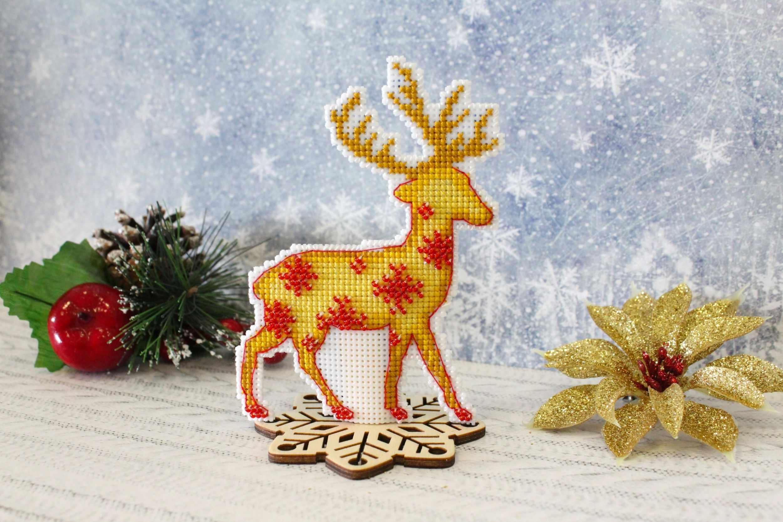 Northern Deer P-455 / SR-455 Plastic Canvas Counted Cross Stitch Kit featuring a Christmas deer design with included threads and instructions.