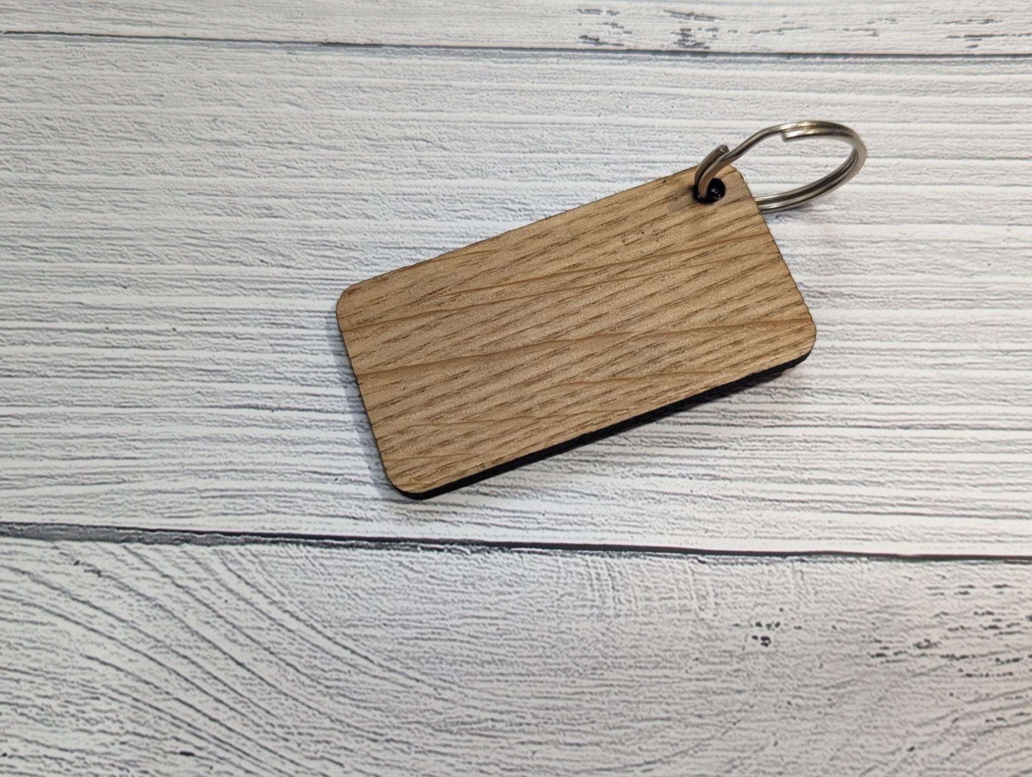 Northern Ireland Flag Keyring made from oak MDF, featuring laser engraved design, showcasing the vibrant colors of the flag.