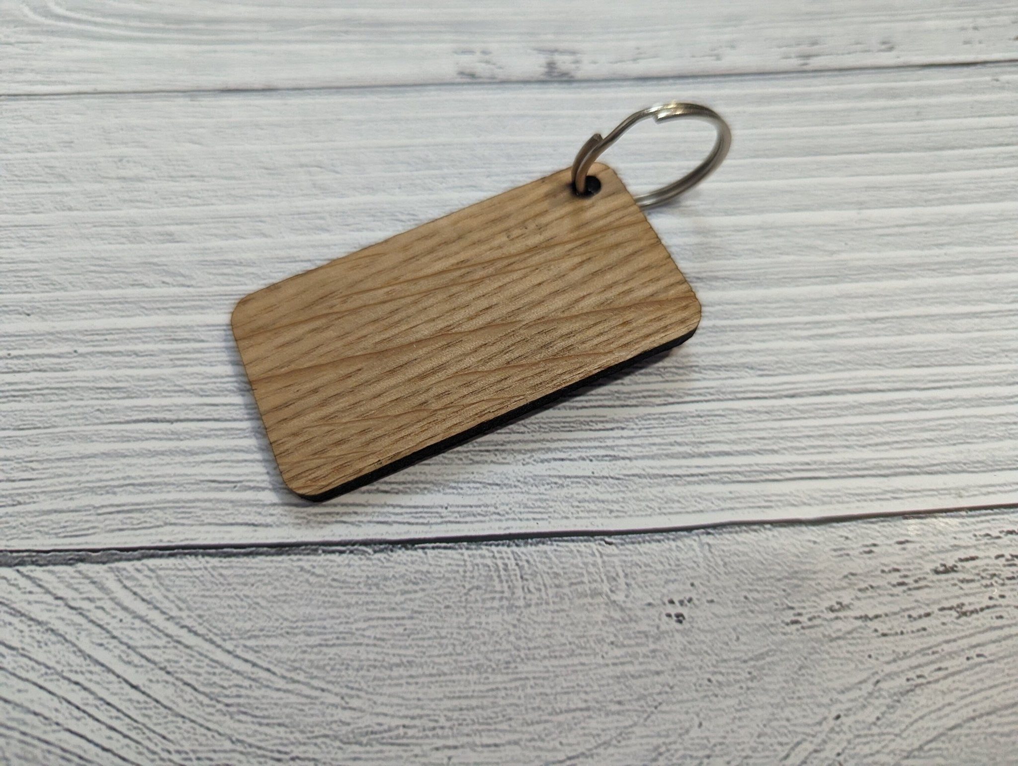 Northern Ireland Flag Keyring made from oak MDF, featuring laser engraved design, showcasing the vibrant colors of the flag.