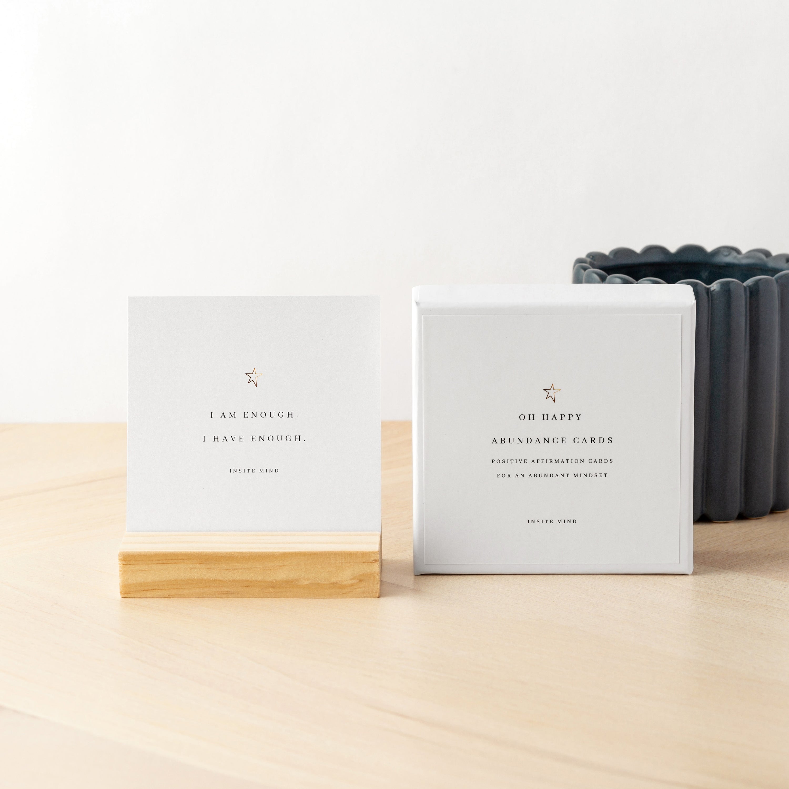 A beautifully designed set of Oh Happy Abundance Cards displayed on a stylish stand, showcasing vibrant affirmations for positivity and abundance.