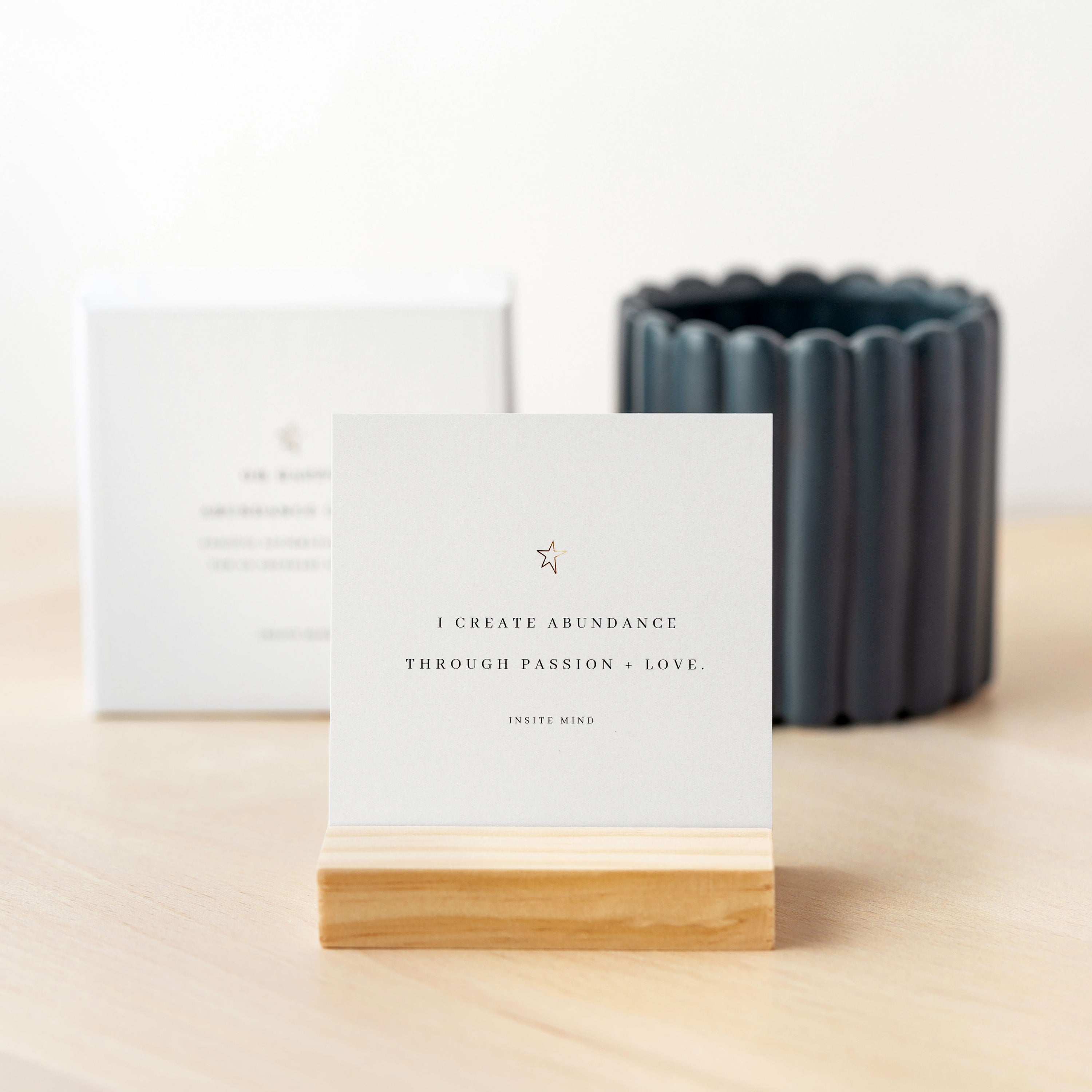 A beautifully designed set of Oh Happy Abundance Cards displayed on a stylish stand, showcasing vibrant affirmations for positivity and abundance.