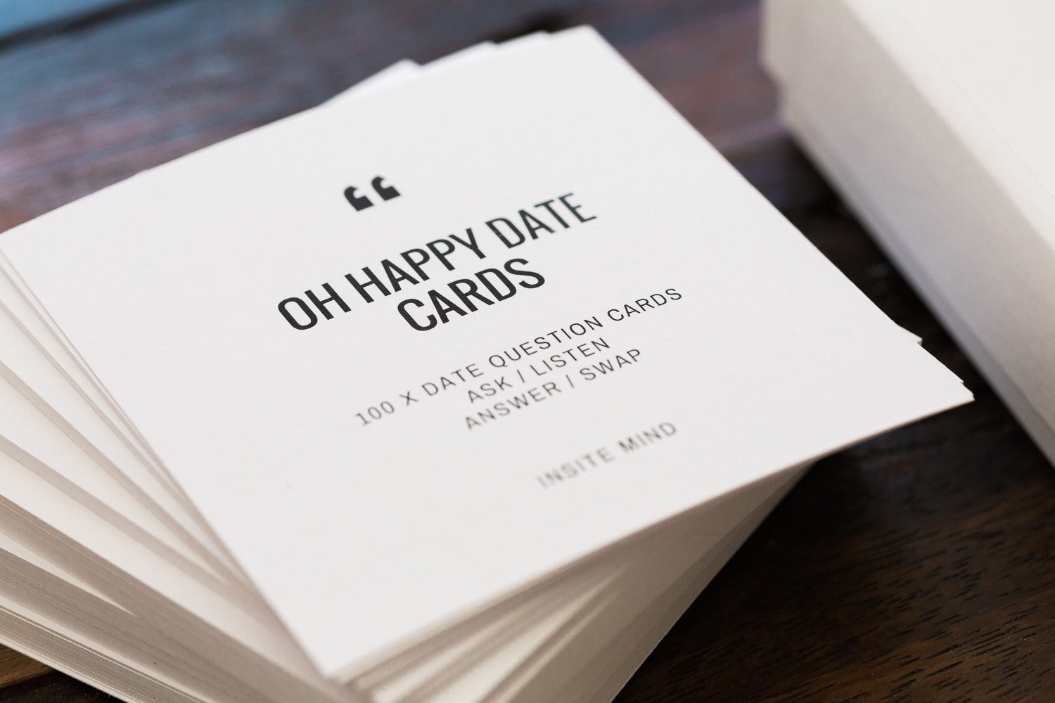 A colorful box of Oh Happy Date Cards featuring 100 engaging prompts for fun date nights and gatherings.