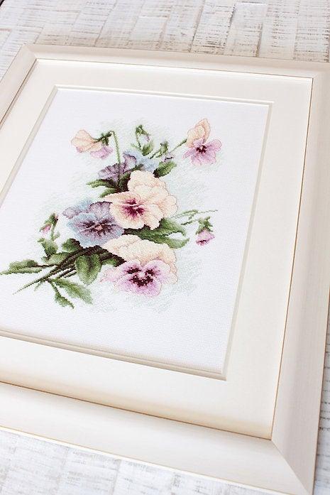Pansies B2231L Counted Cross-Stitch Kit featuring colorful threads, Aida canvas, and needle, designed by Catharina Klein.