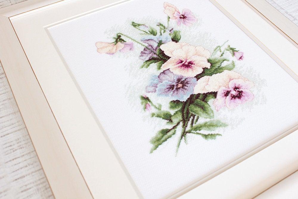 Pansies B2231L Counted Cross-Stitch Kit featuring colorful threads, Aida canvas, and needle, designed by Catharina Klein.