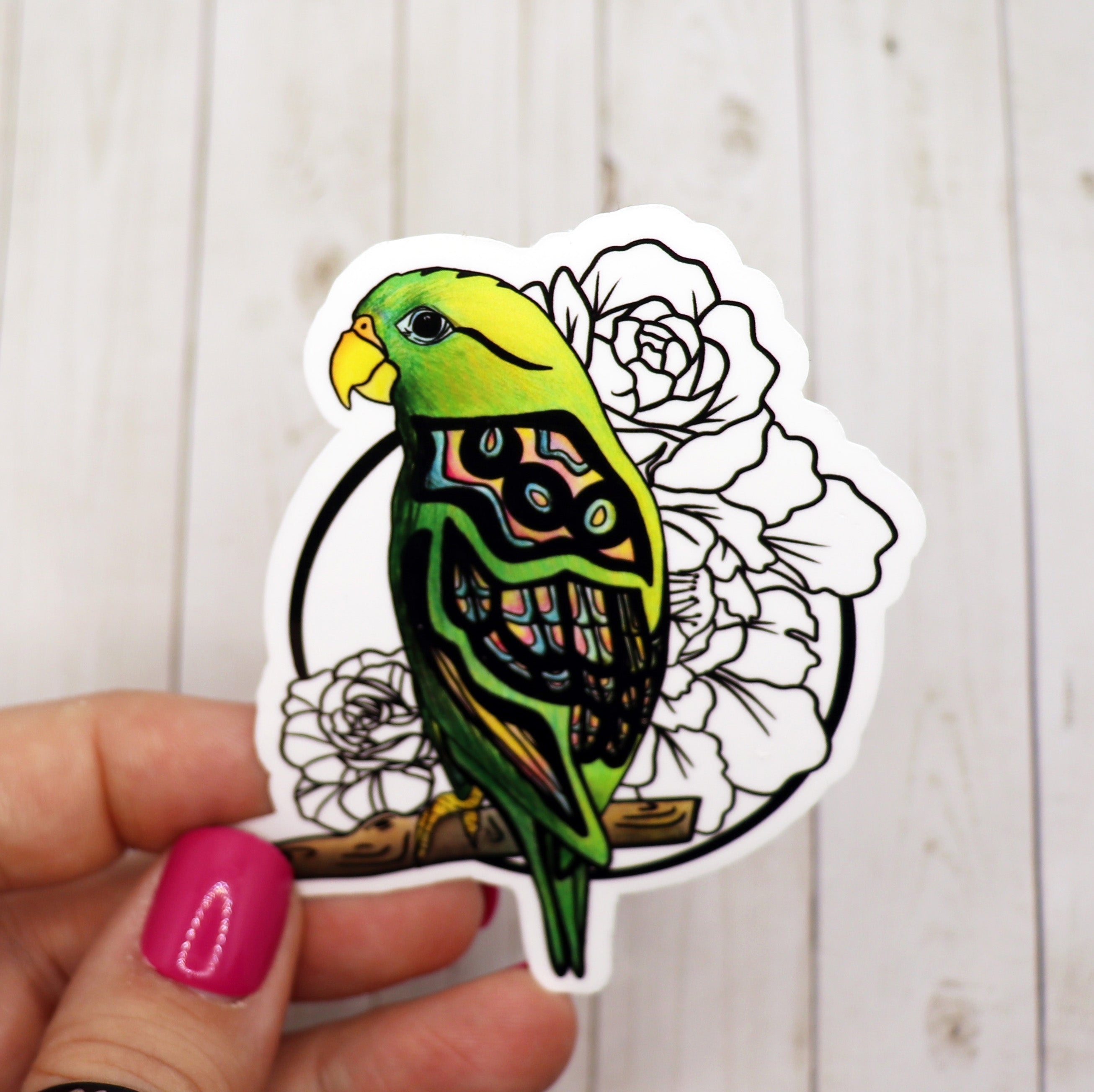 Colorful parrot sticker on a matte vinyl surface, showcasing vibrant colors and intricate details.