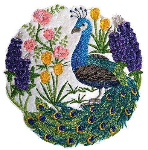 A vibrant embroidered patch featuring a peacock scene, showcasing intricate details and colors on a cotton base.