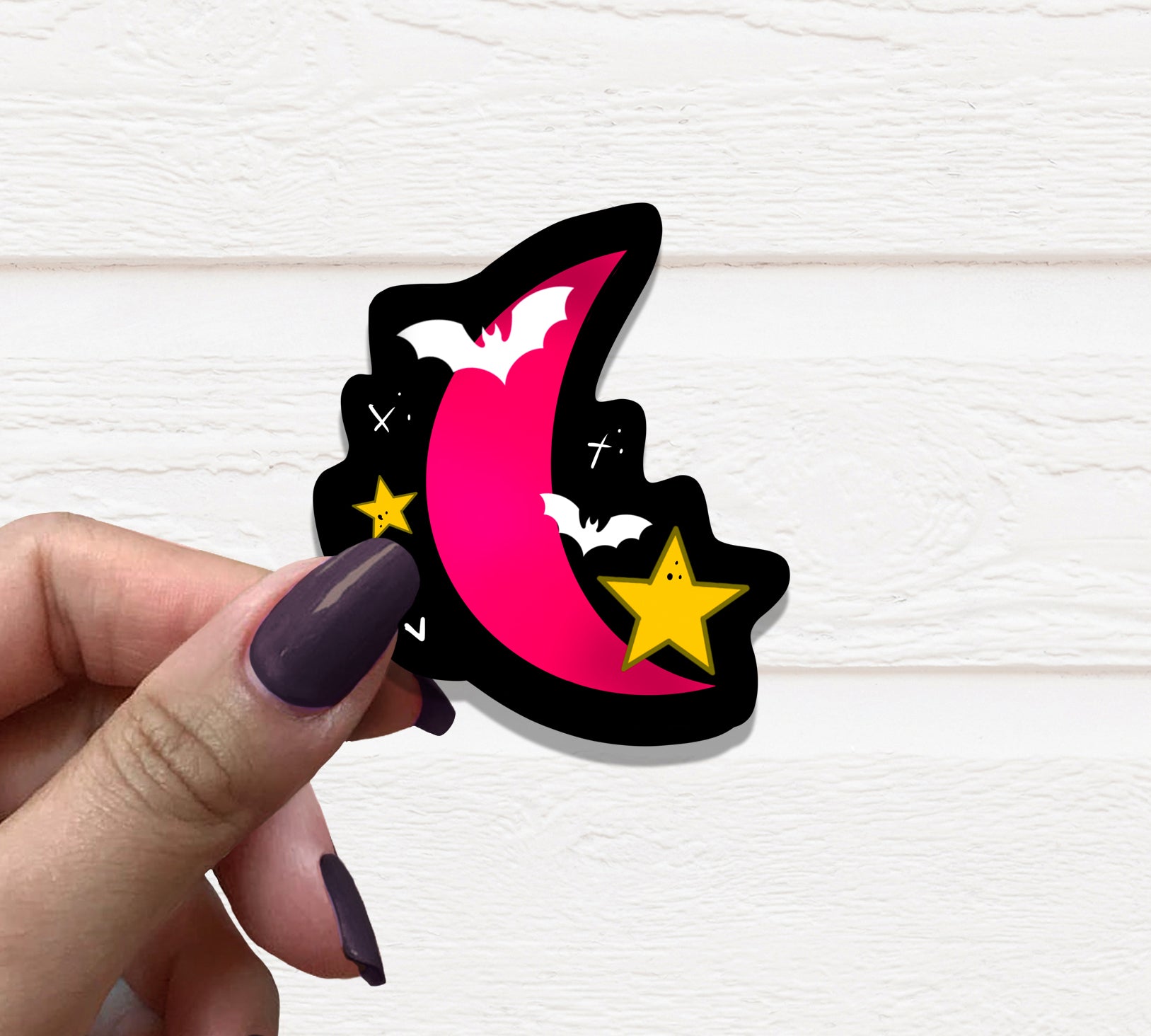 A vibrant Pink Moon Vinyl Sticker featuring a beautifully designed moon against a soft background, perfect for personalizing various items.