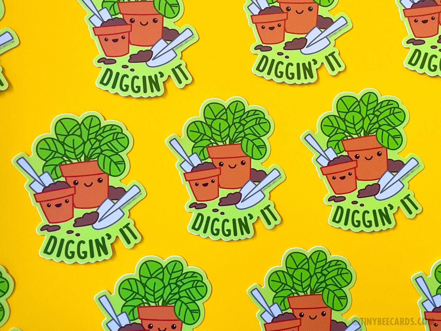 Colorful vinyl sticker featuring cute planters and the pun 'Diggin' It', perfect for plant lovers.