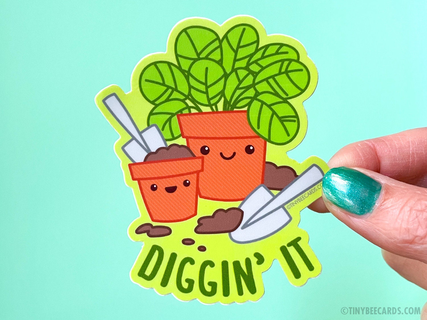Colorful vinyl sticker featuring cute planters and the pun 'Diggin' It', perfect for plant lovers.