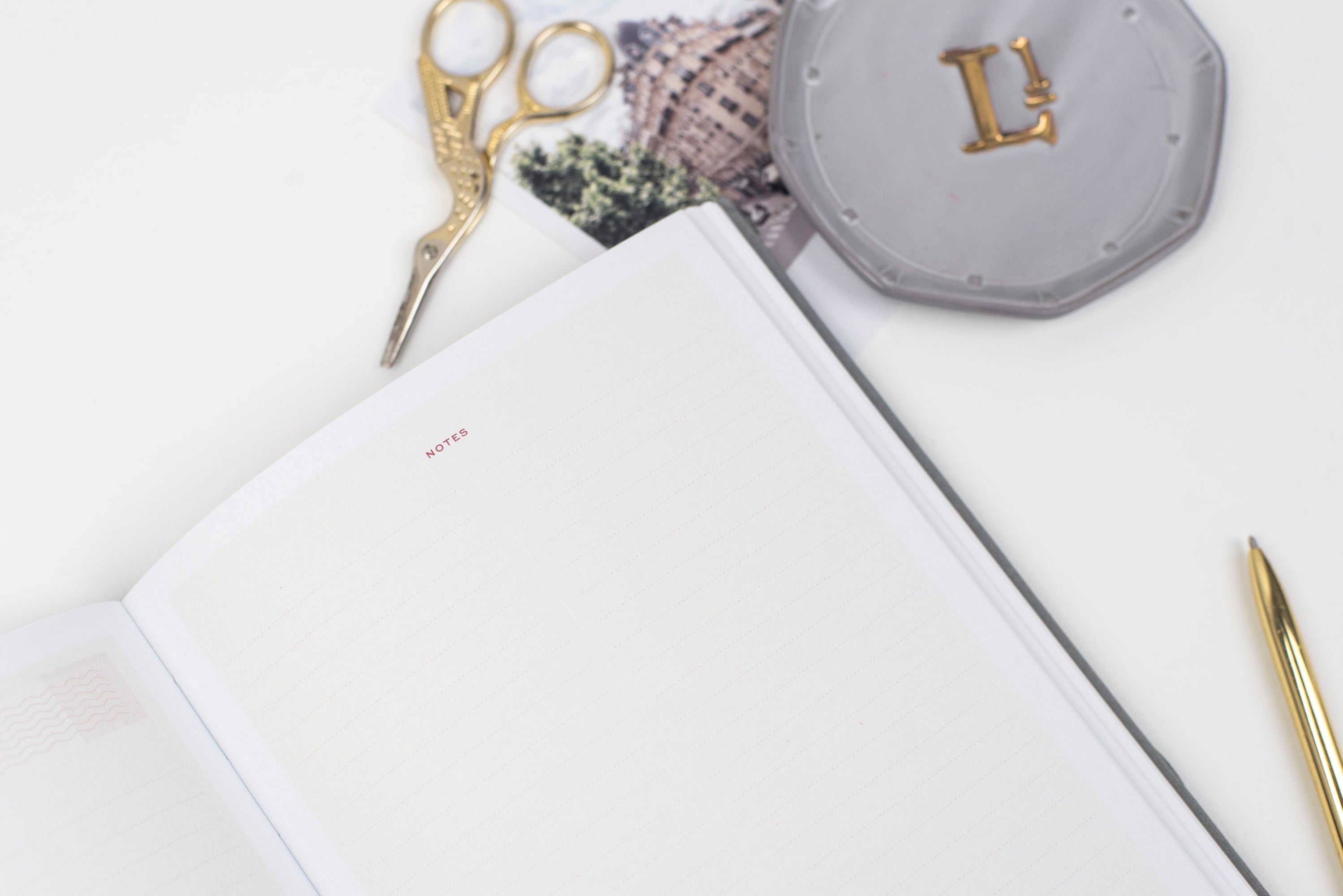 Ponderlily Weekly Planner 2023 in Midnight Blue with copper foil lettering, showcasing its elegant design and eco-friendly materials.