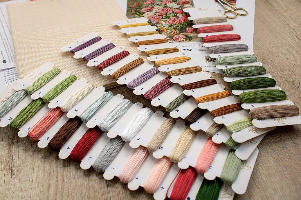 Posies for the Princess B603L Counted Cross-Stitch Kit featuring Aida canvas, colorful threads, and needle for crafting.