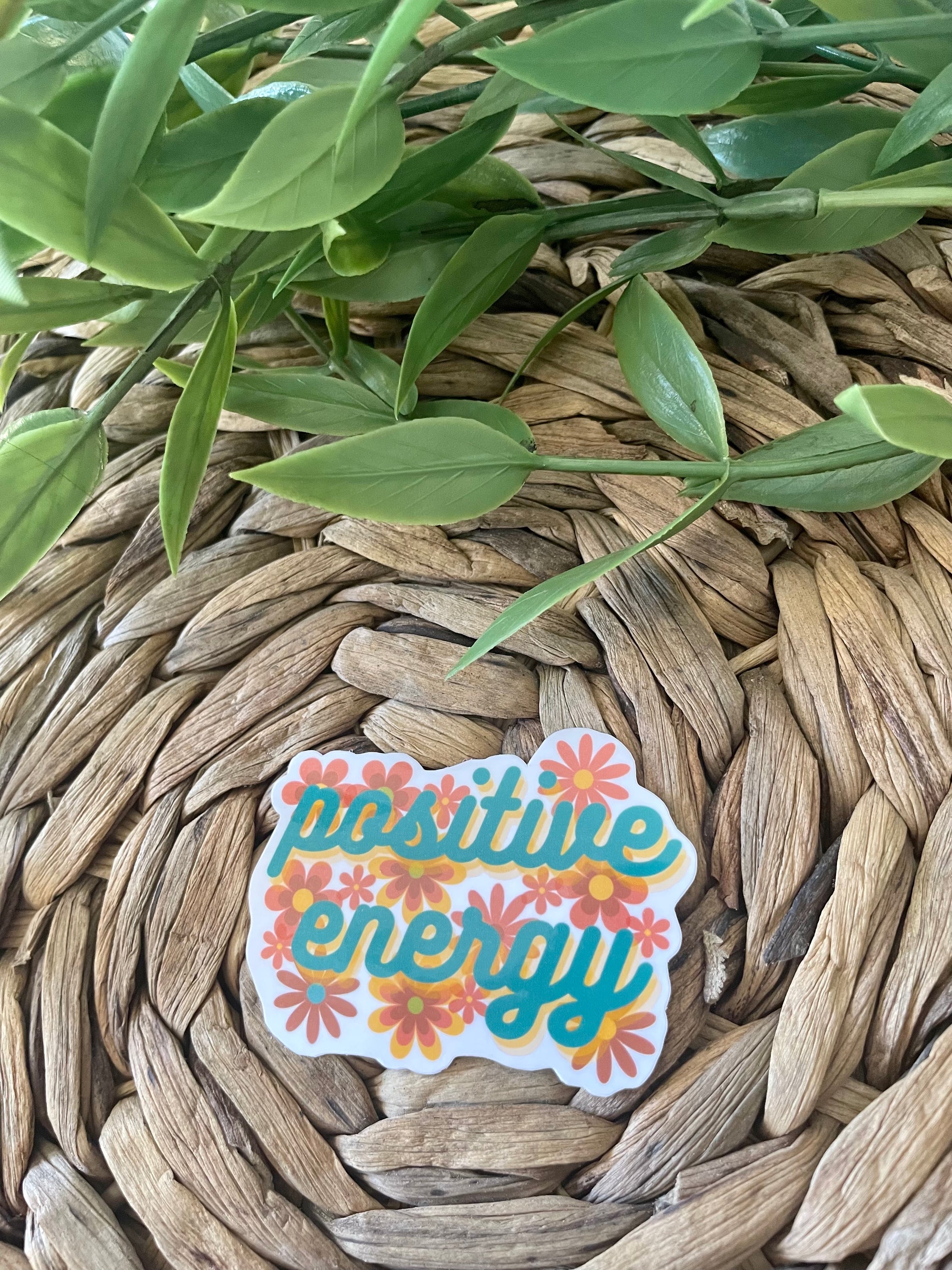 A colorful Positive Energy Sticker featuring uplifting designs, perfect for personalizing items like hydroflasks and laptops.