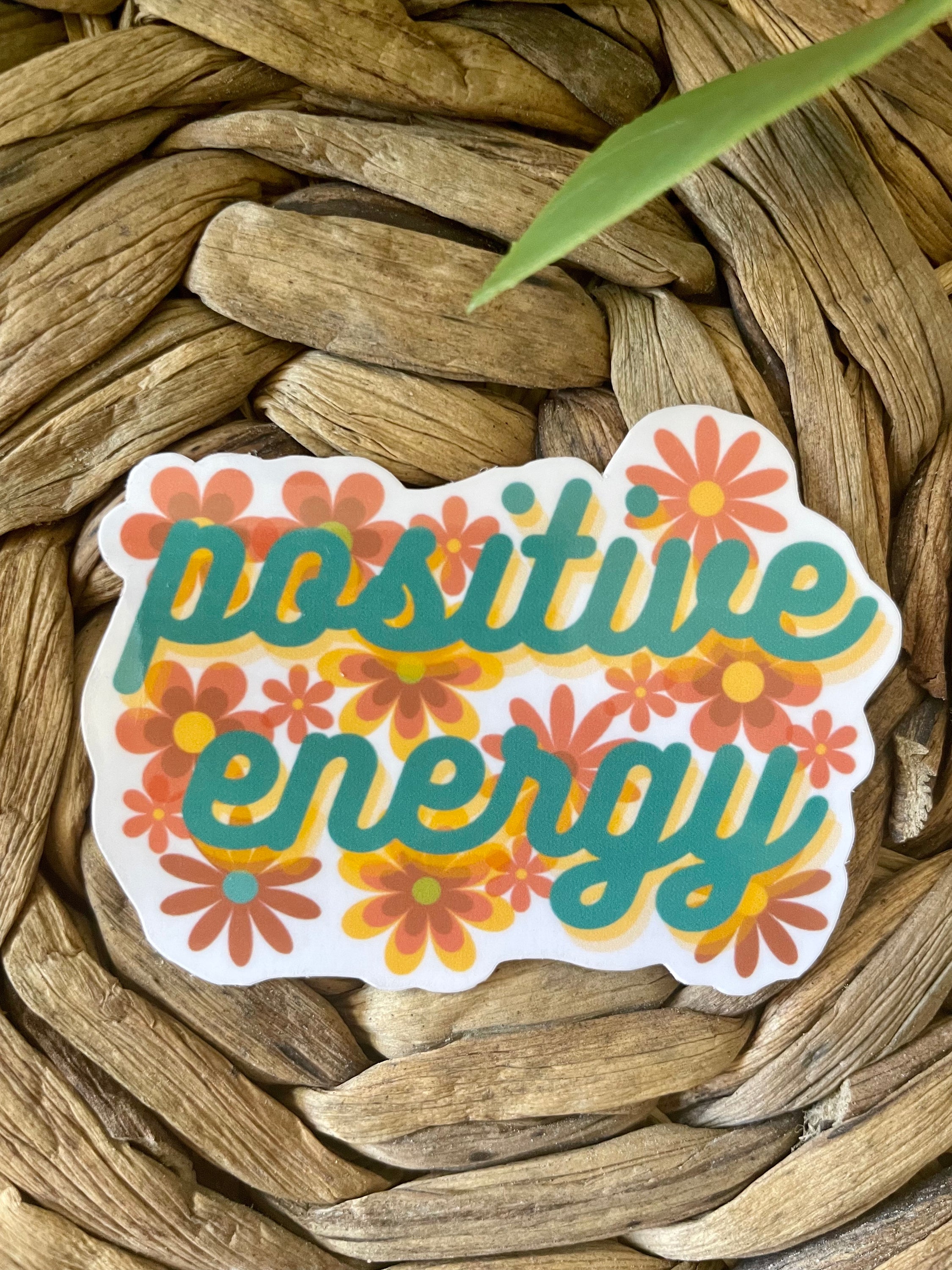 A colorful Positive Energy Sticker featuring uplifting designs, perfect for personalizing items like hydroflasks and laptops.