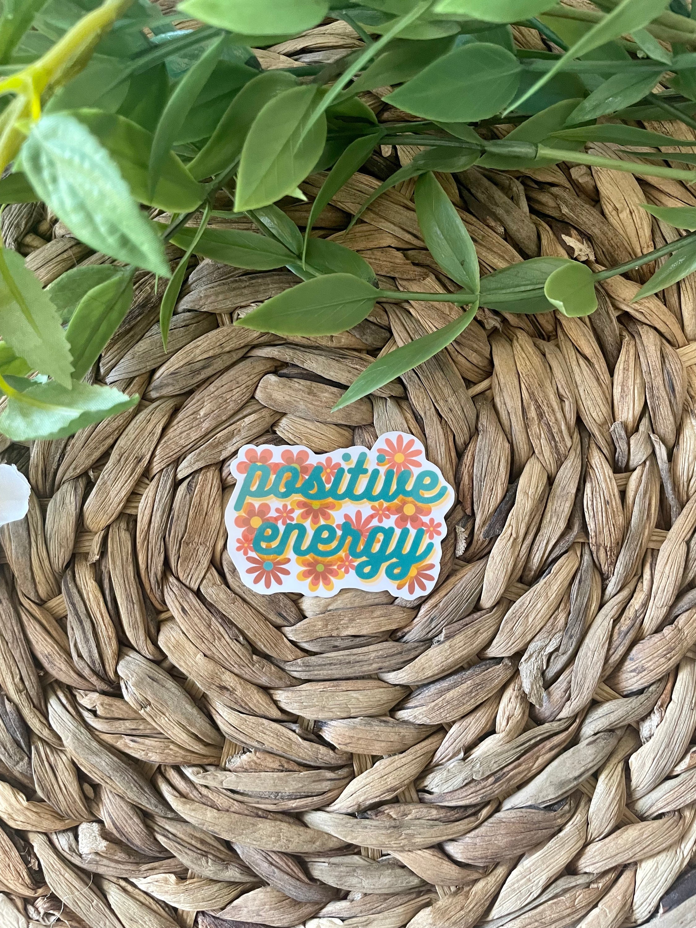 A colorful Positive Energy Sticker featuring uplifting designs, perfect for personalizing items like hydroflasks and laptops.