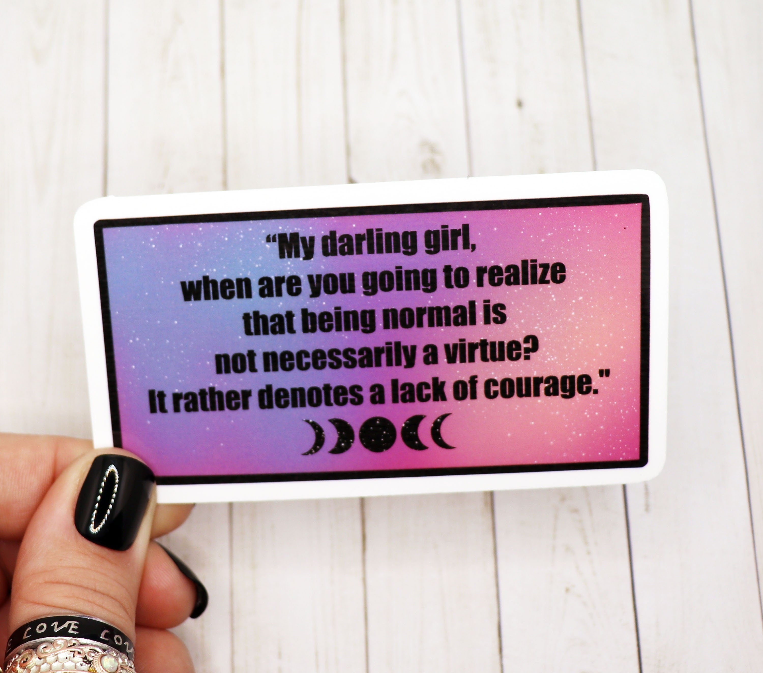 A 3-inch Practical Magic quote vinyl sticker featuring a charming design, perfect for personalizing various items.