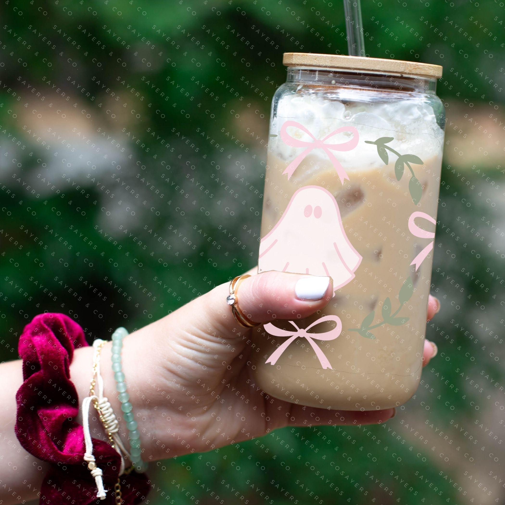 A 16oz cup featuring a whimsical Pink Ghosts Wrap design, perfect for Halloween-themed drinkware.