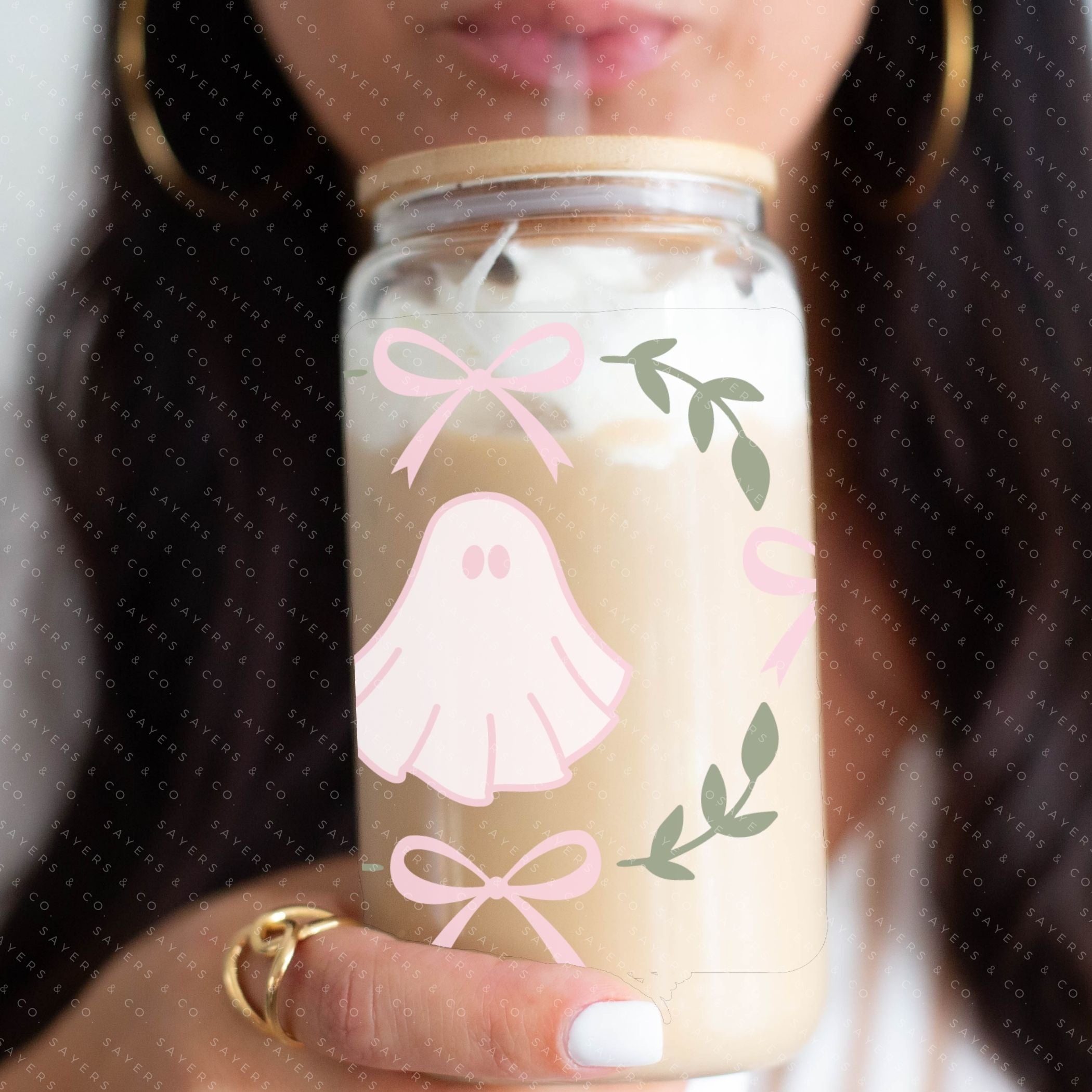 A 16oz cup featuring a whimsical Pink Ghosts Wrap design, perfect for Halloween-themed drinkware.