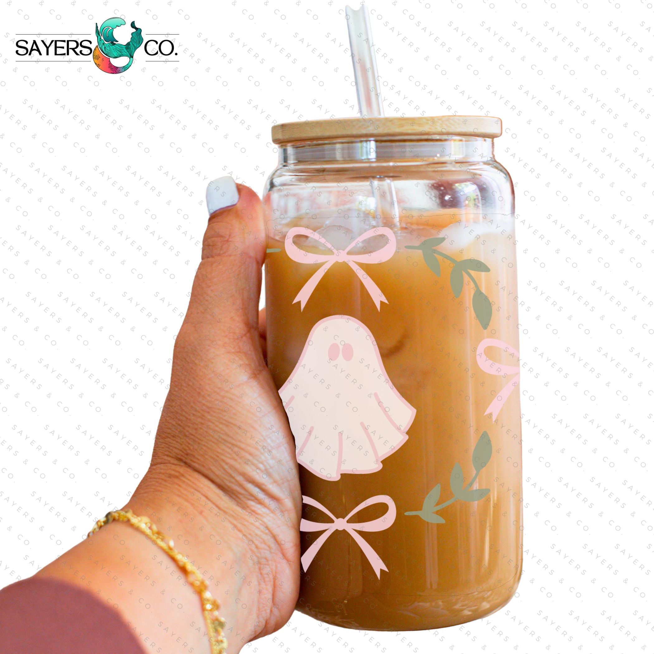 A 16oz cup featuring a whimsical Pink Ghosts Wrap design, perfect for Halloween-themed drinkware.