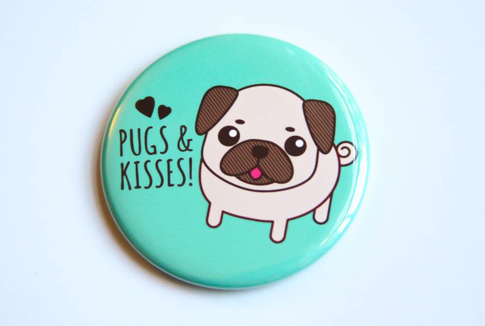 A round 2.25-inch button featuring a cute pug design with the text 'Pugs & Kisses!' available as a magnet, pin, or mirror.
