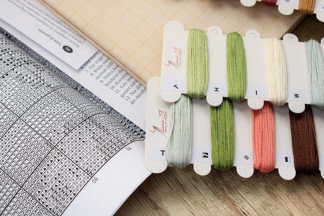 Pumpkin B2303L Counted Cross-Stitch Kit with Aida canvas, colorful threads, and needle, showcasing autumn-themed design.