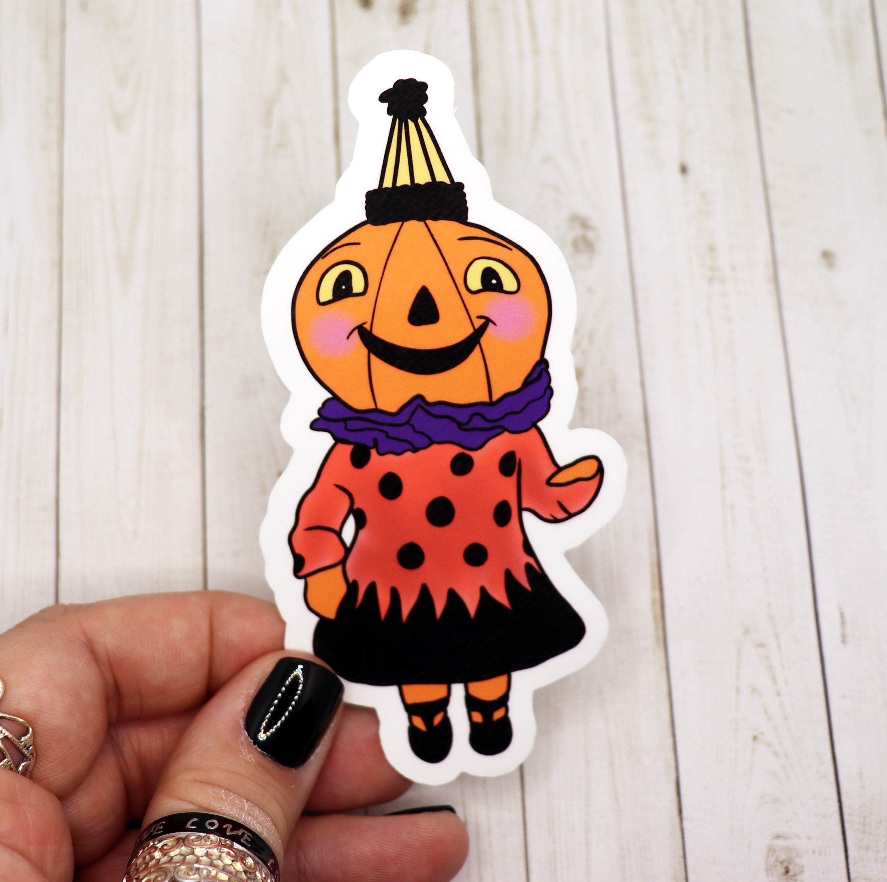 A vibrant Pumpkin Girl Sticker featuring a whimsical design, perfect for decorating various surfaces.