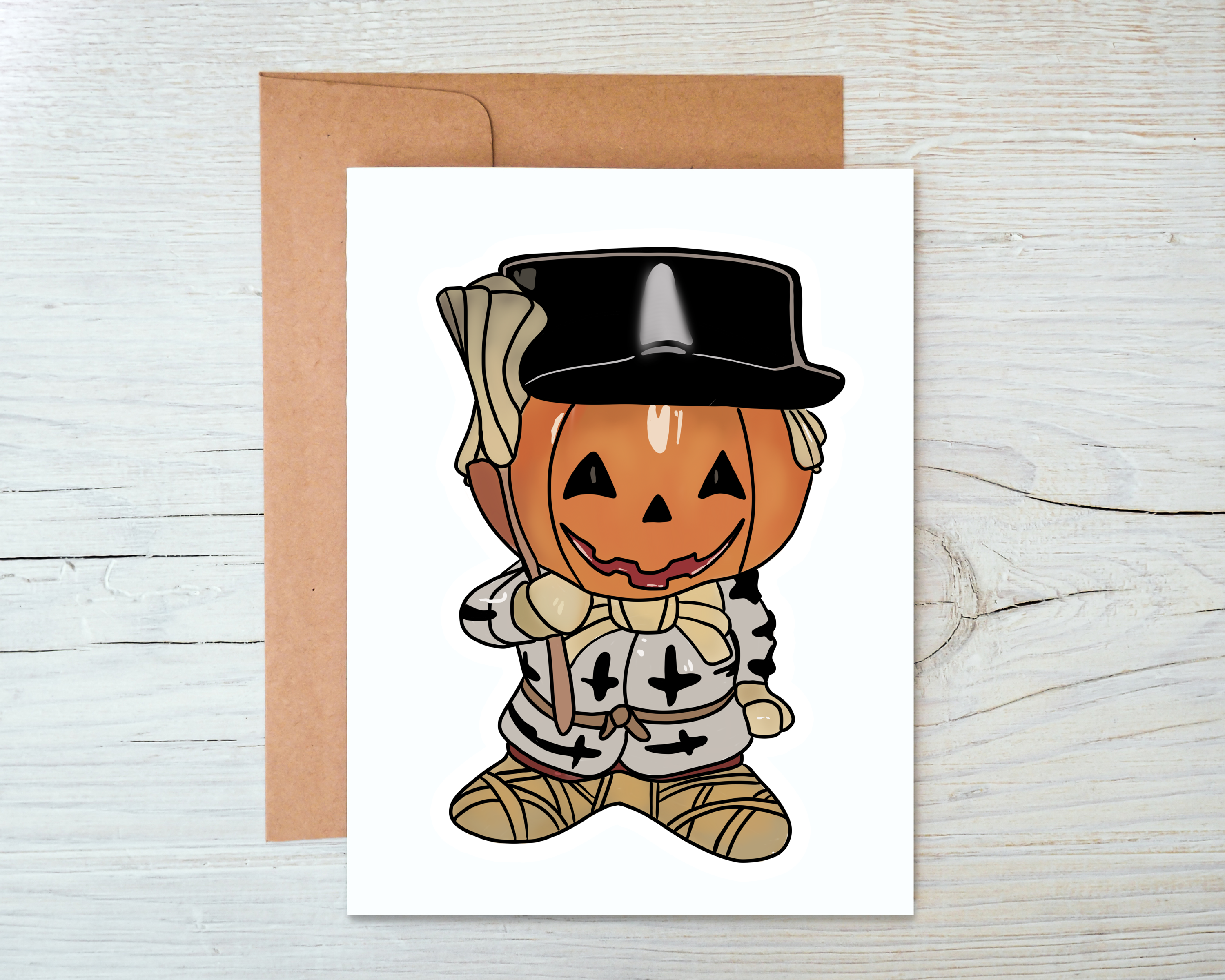 A whimsical Pumpkin Head Card featuring a cute pumpkin design on the front, with a blank interior and a kraft envelope.
