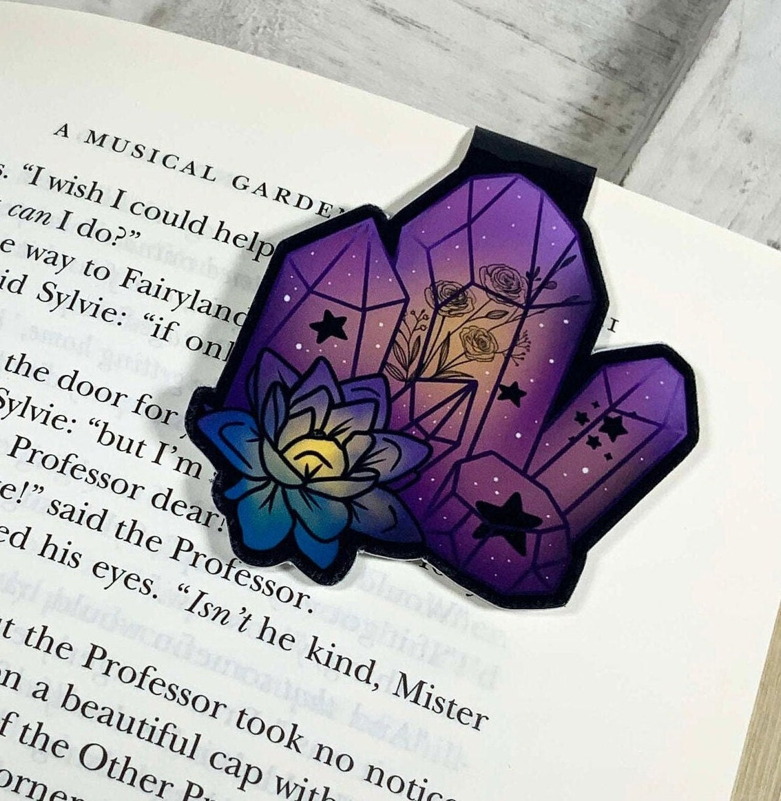 A beautiful purple crystal magnetic bookmark, showcasing its elegant design and strong magnets, perfect for book lovers.