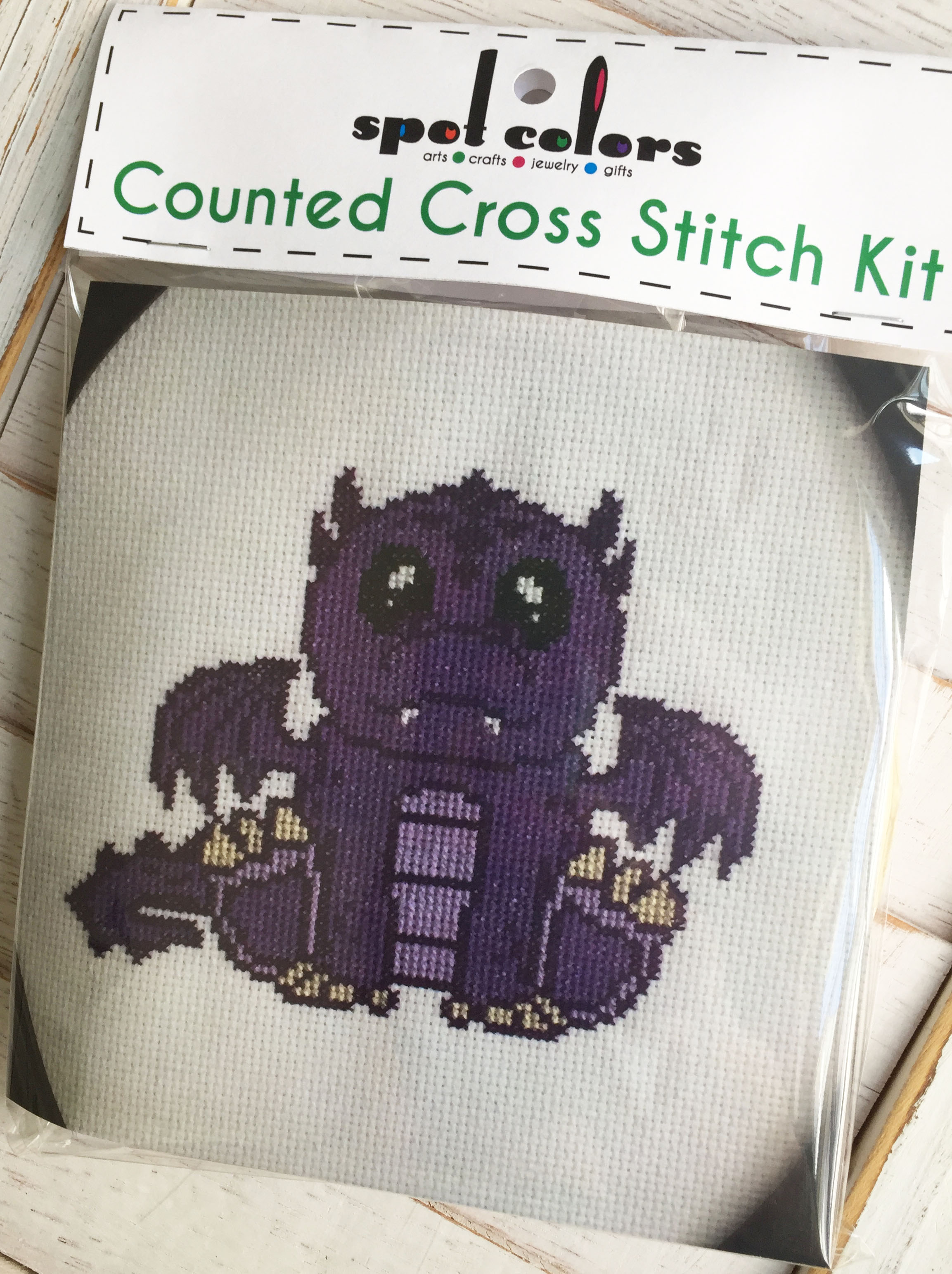Purple Dragon Counted Cross Stitch DIY Kit with supplies and design pattern.