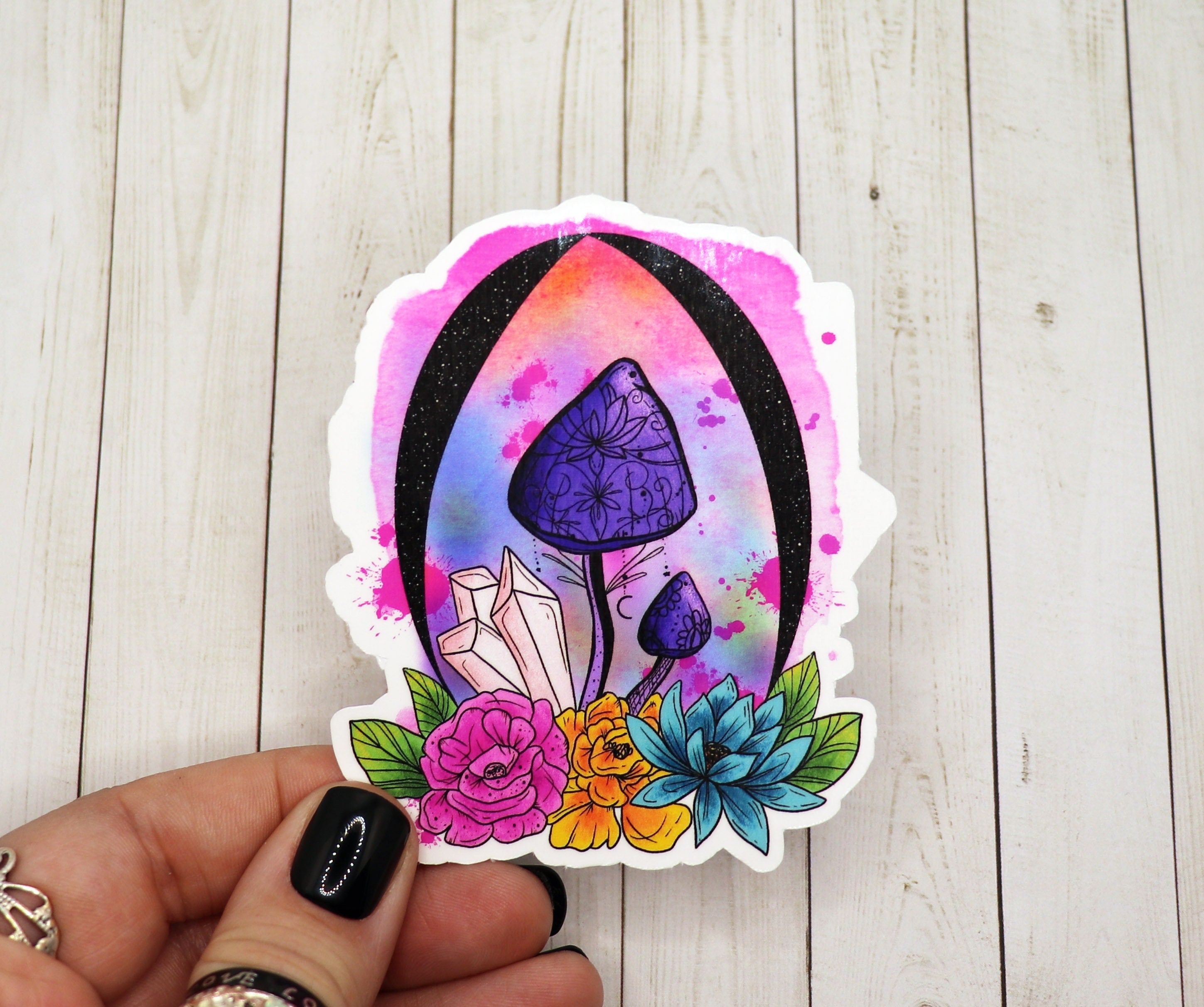 A vibrant purple mushroom sticker with crystal accents on a matte vinyl background, showcasing its intricate design.