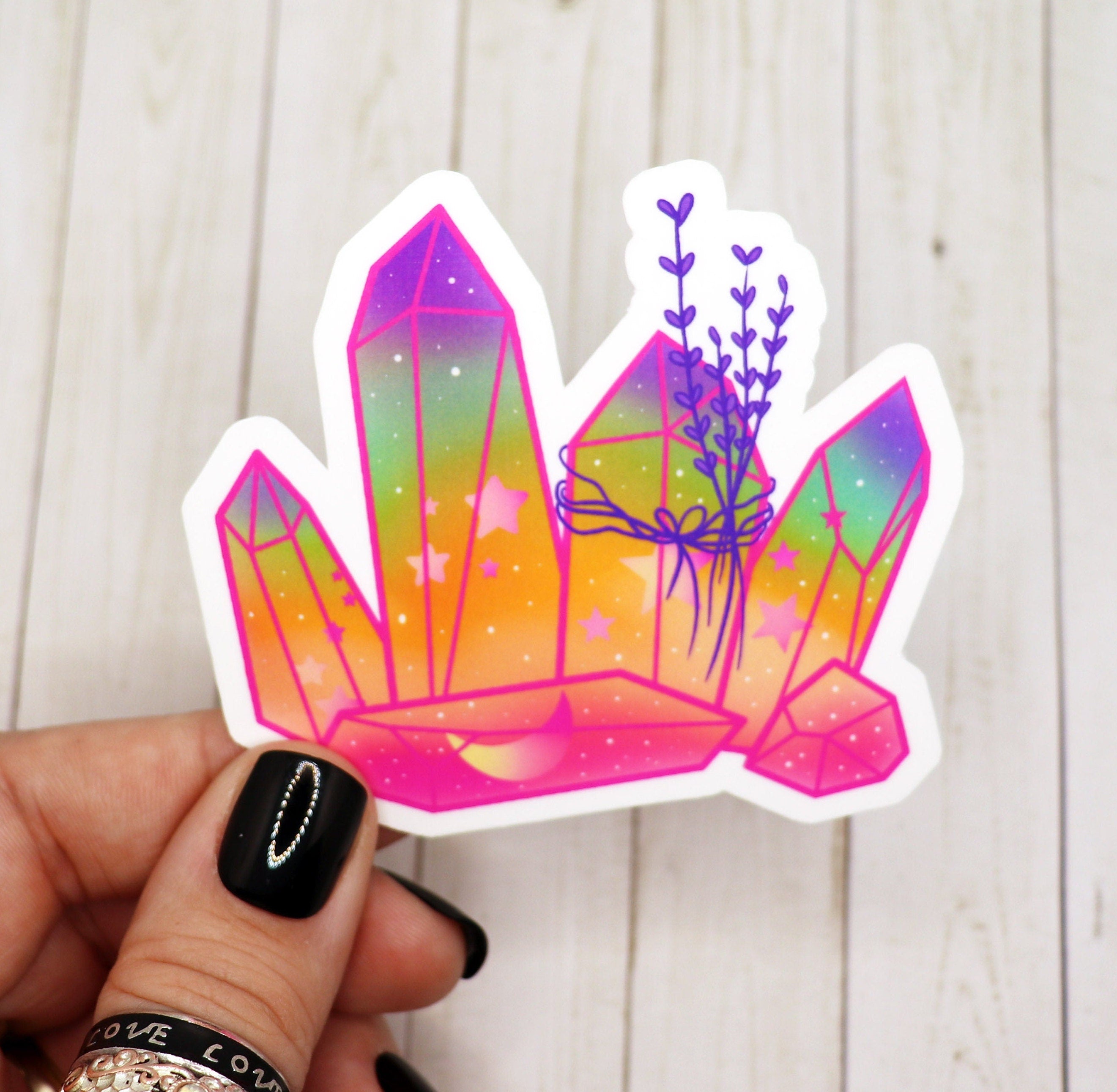 A vibrant Rainbow Crystal Sticker showcasing a colorful design on a matte vinyl surface, perfect for personalizing various items.
