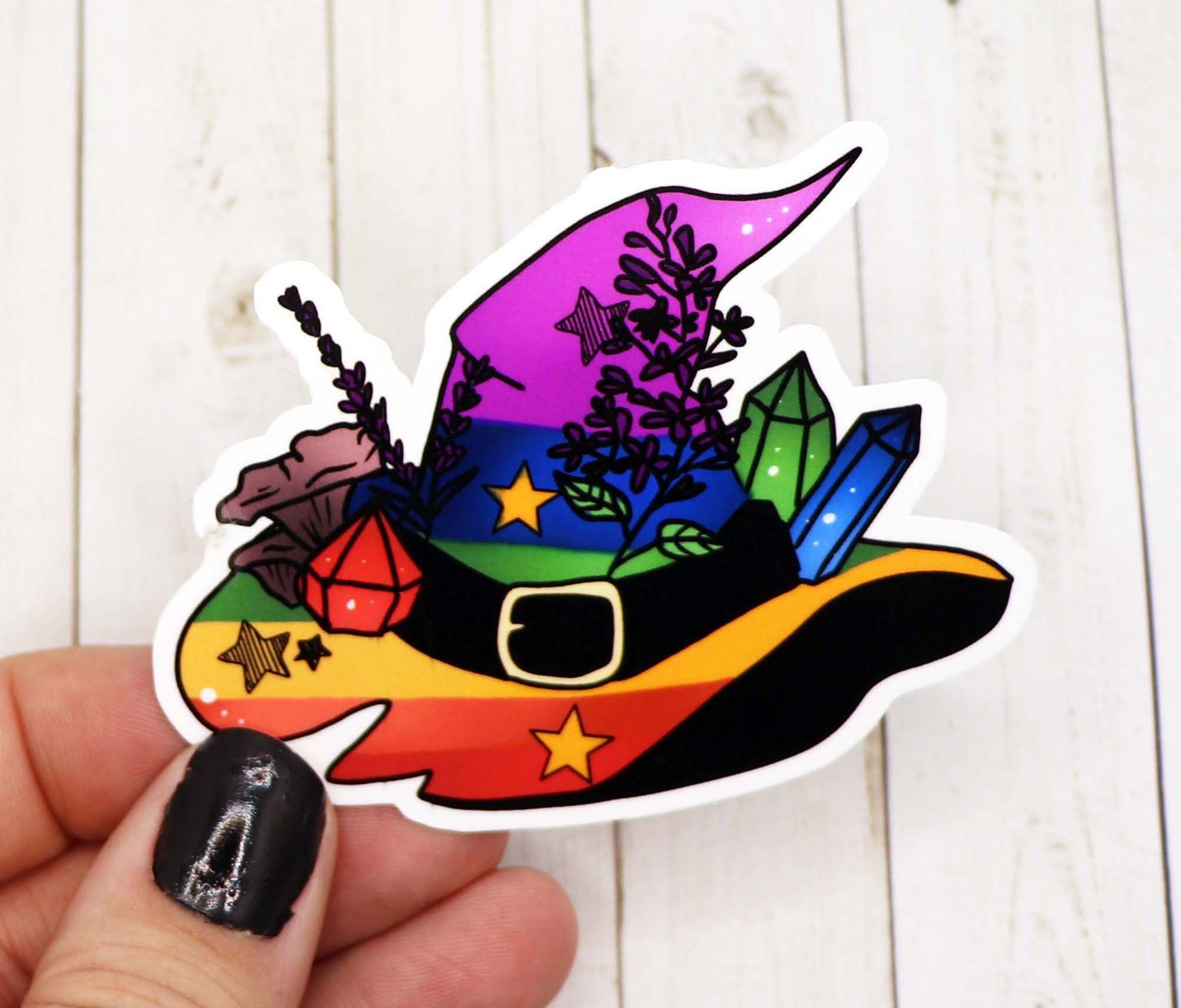 Colorful Rainbow Pride Witch Hat Sticker on a white background, showcasing vibrant colors and intricate design.