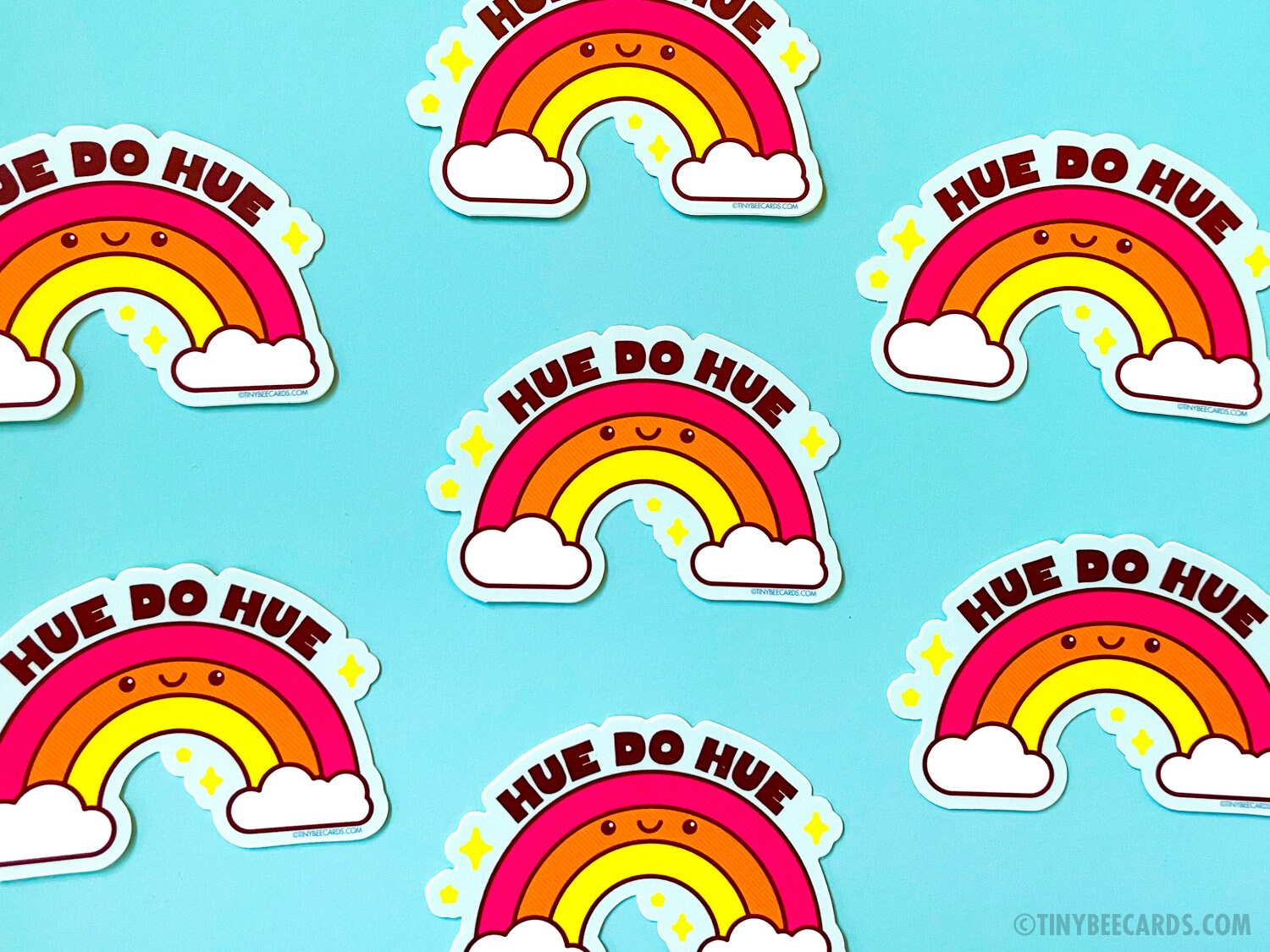 Colorful rainbow vinyl sticker with pun text 'Hue do hue!' on a sky blue background, perfect for personalizing items.