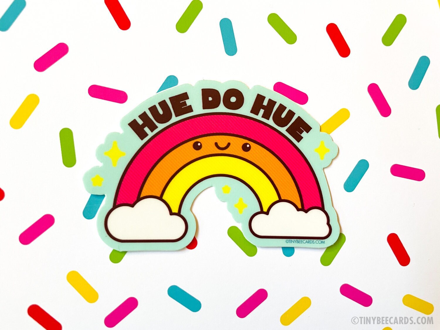Colorful rainbow vinyl sticker with pun text 'Hue do hue!' on a sky blue background, perfect for personalizing items.