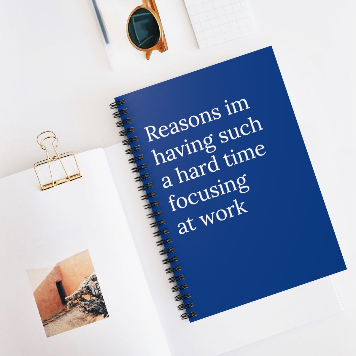 A humorous spiral notebook titled 'Reasons I'm Having Such A Hard Time Focusing At Work' with ruled line pages, perfect for office use.