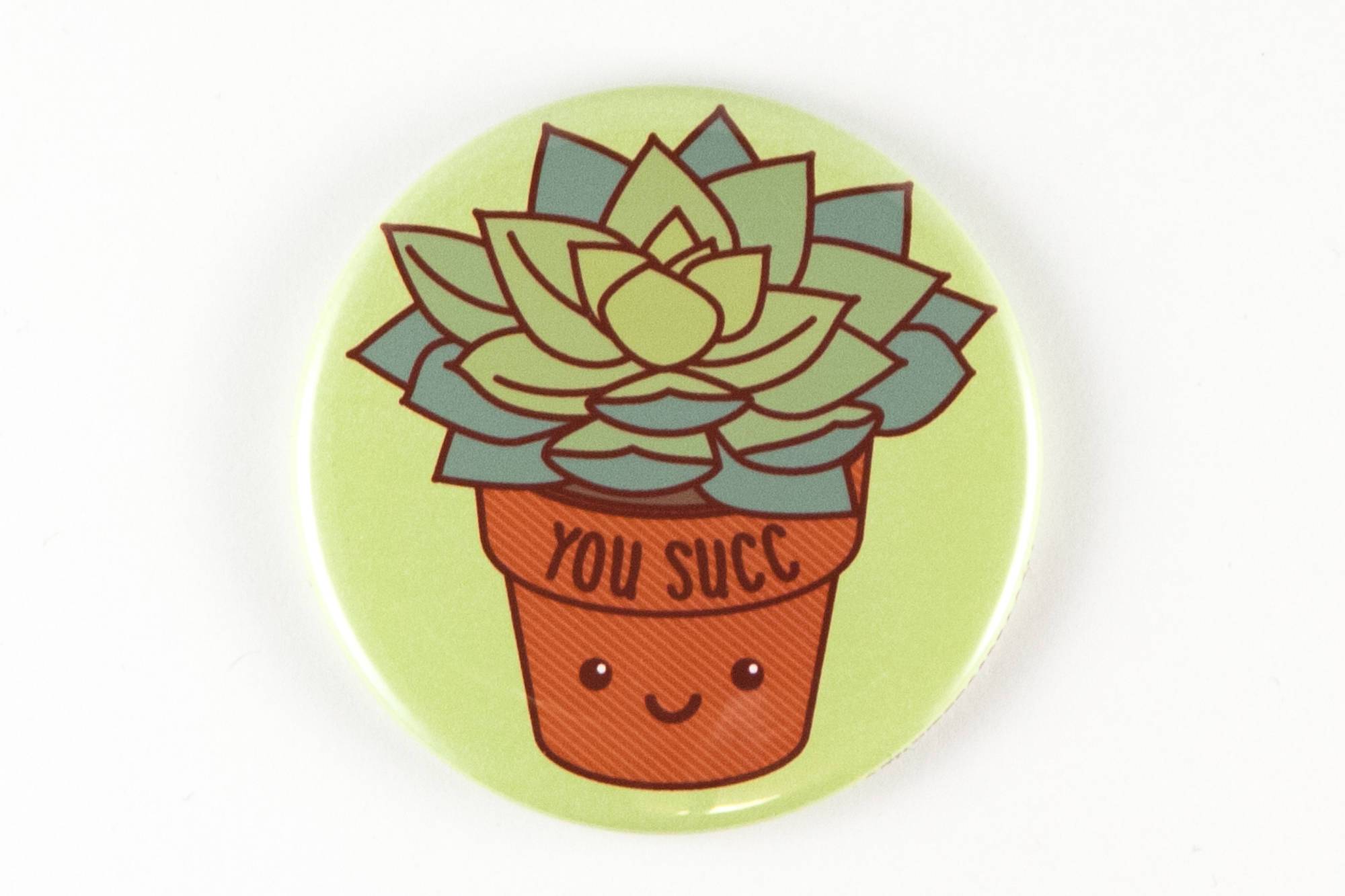 A 2.25-inch round magnet featuring a kawaii succulent plant with the text 'You Succ!' in a playful font.