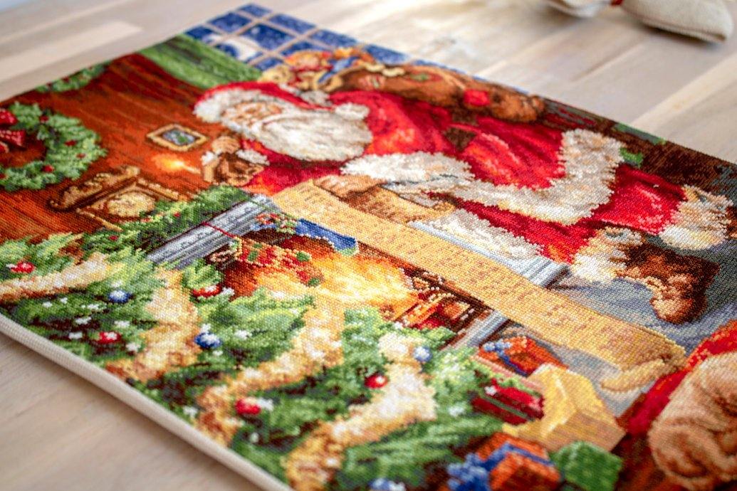 Santa Claus B578L Counted Cross-Stitch Kit featuring Aida canvas, colorful threads, and needle for holiday crafting.