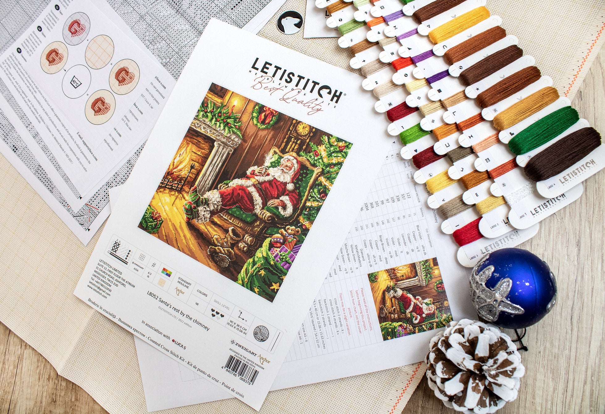 Santa's Rest by the Chimney L8052 Counted Cross Stitch Kit featuring vibrant colors and detailed design.