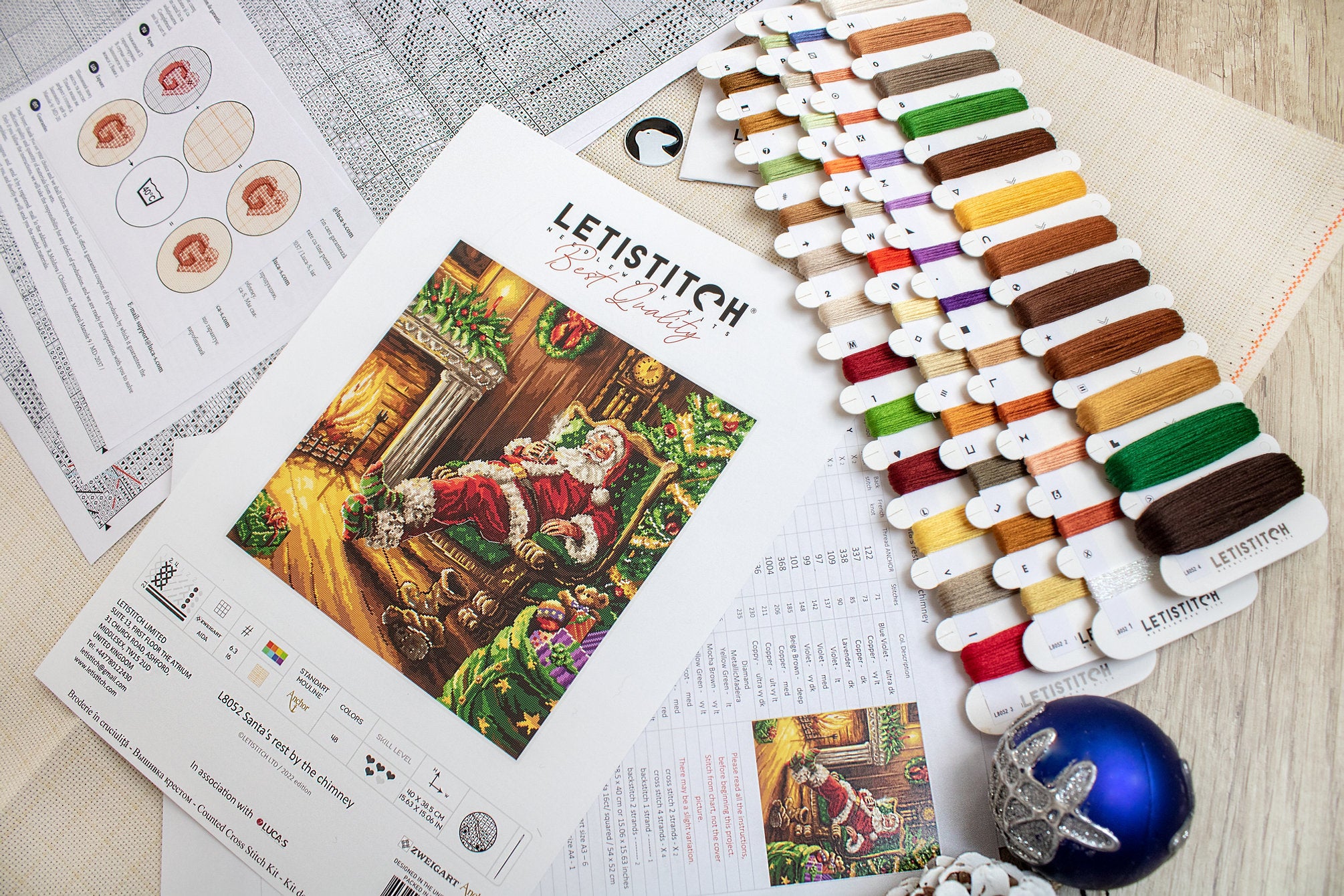 Santa's Rest by the Chimney L8052 Counted Cross Stitch Kit featuring vibrant colors and detailed design.