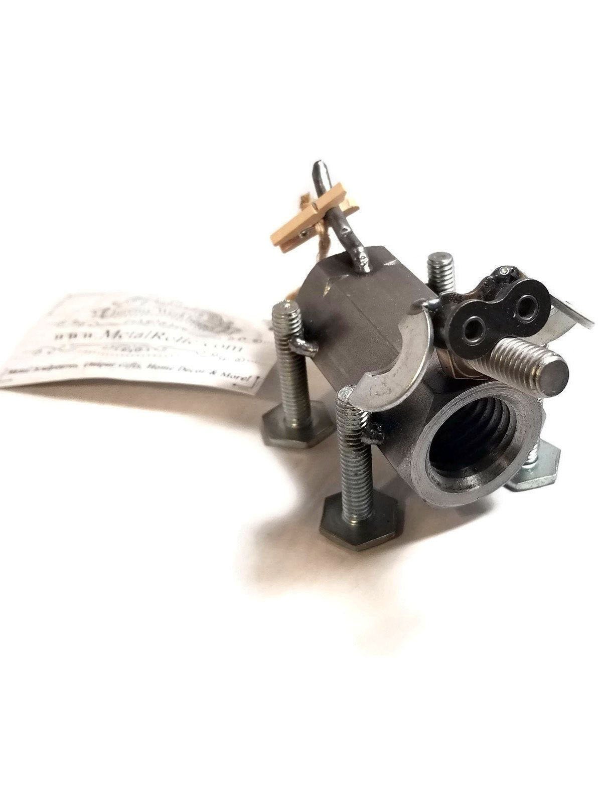 A handcrafted scrap metal dog figurine made from nuts, bolts, and other metal parts, showcasing a rustic and artistic design, perfect for home decor.