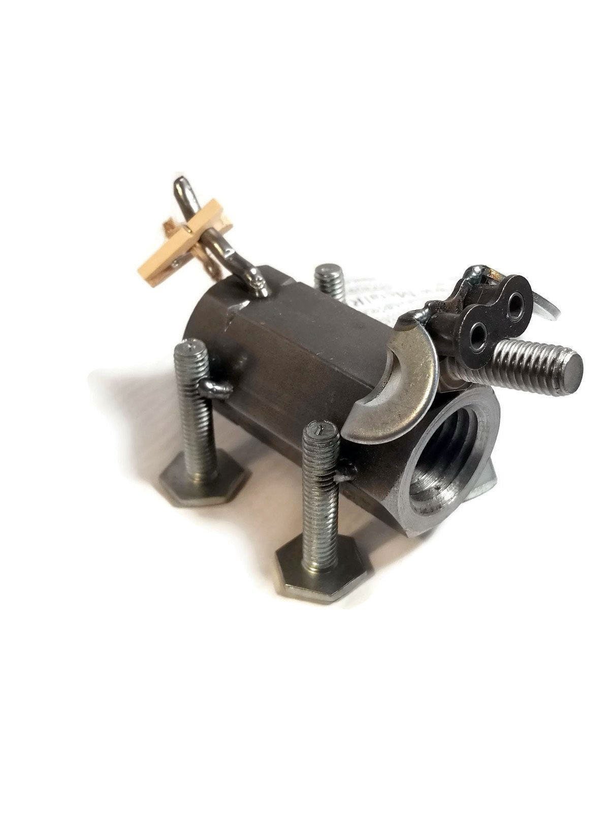 A handcrafted scrap metal dog figurine made from nuts, bolts, and other metal parts, showcasing a rustic and artistic design, perfect for home decor.