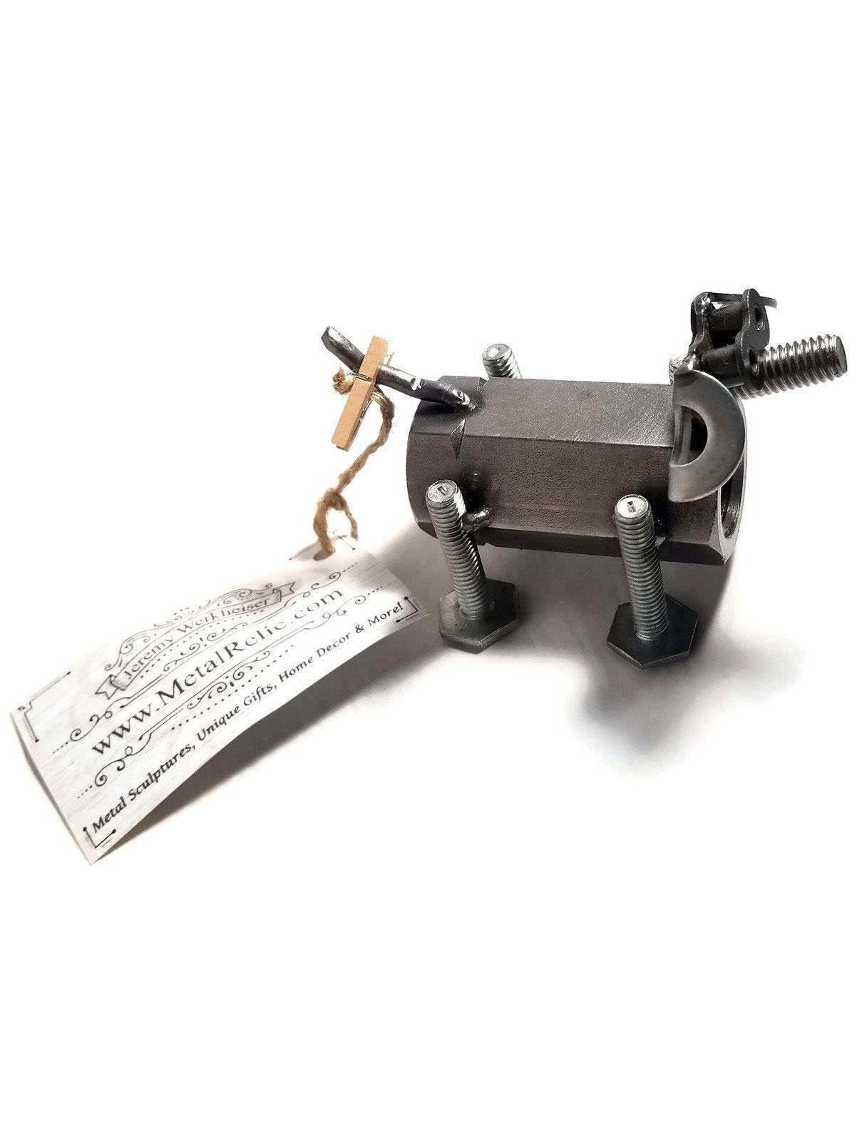 A handcrafted scrap metal dog figurine made from nuts, bolts, and other metal parts, showcasing a rustic and artistic design, perfect for home decor.