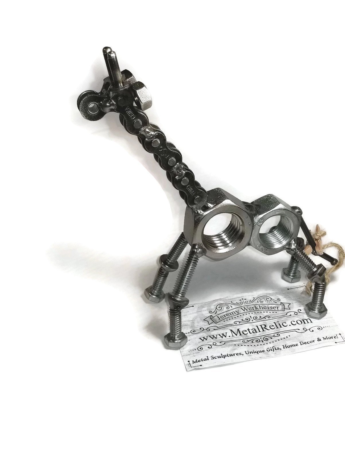 Handmade scrap metal giraffe figurine crafted from nuts, bolts, and screws, featuring a rustic finish and protective coating.