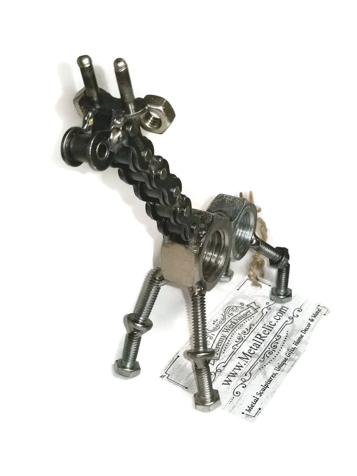 Handmade scrap metal giraffe figurine crafted from nuts, bolts, and screws, featuring a rustic finish and protective coating.