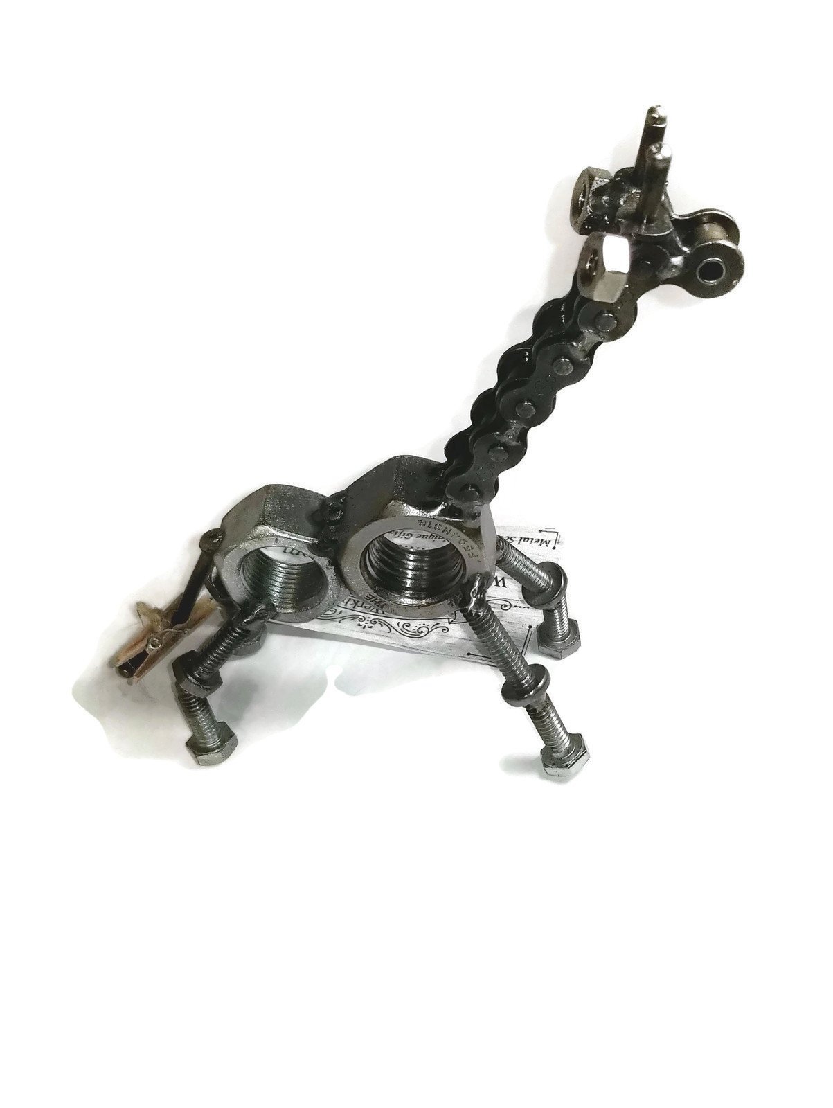 Handmade scrap metal giraffe figurine crafted from nuts, bolts, and screws, featuring a rustic finish and protective coating.