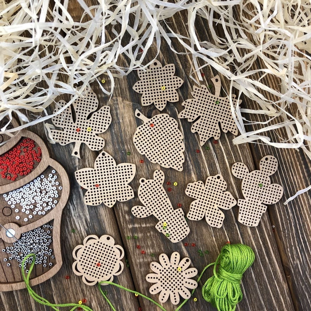 Set of 20 wooden embroidery blanks with intricate designs, perfect for creative needlework projects.
